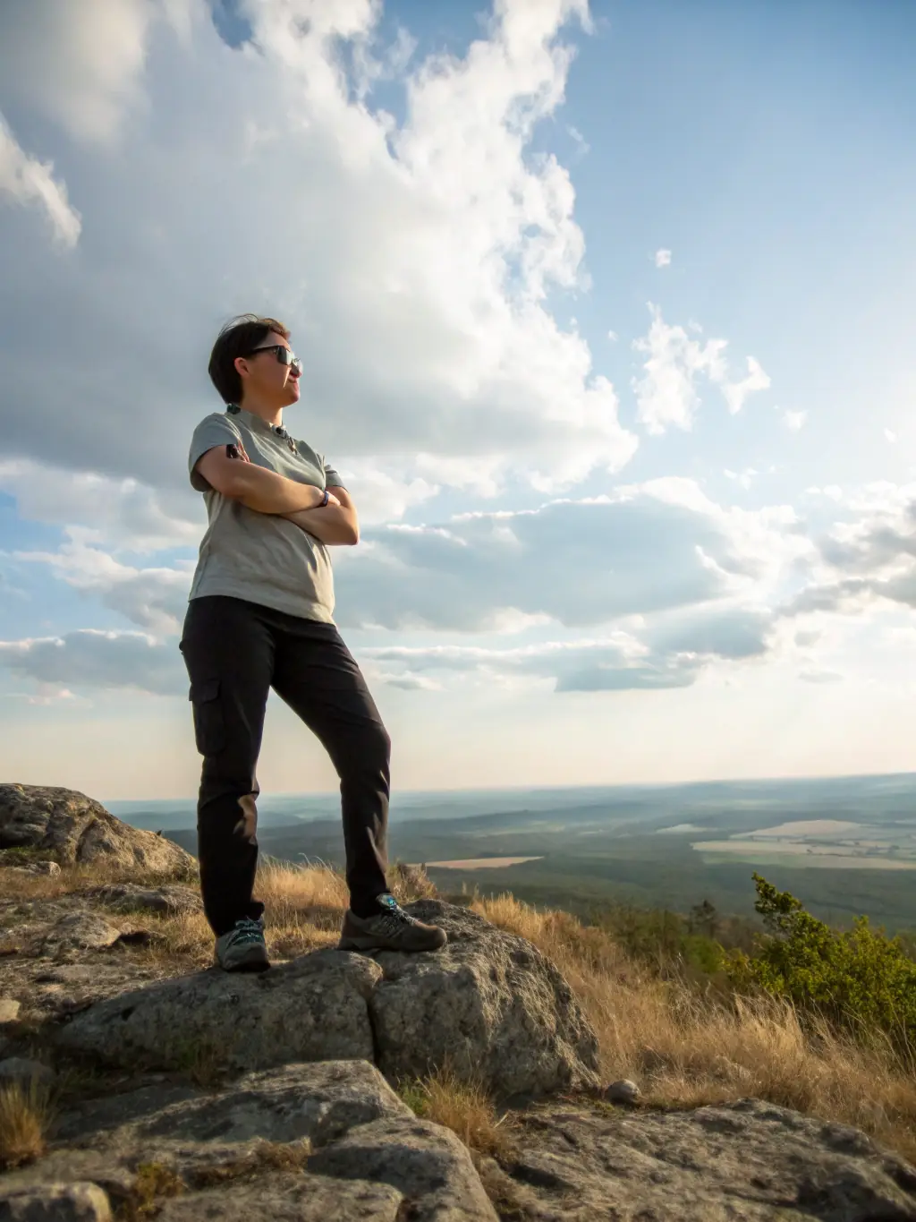 An individual standing confidently, representing the empowerment and self-discovery that comes from living authentically through stressor therapy.